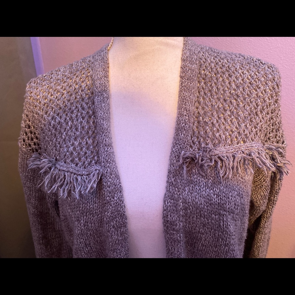 A gray cardigan